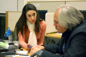 A law student speaks with John Willshire Carrera, a HIRCP attorney